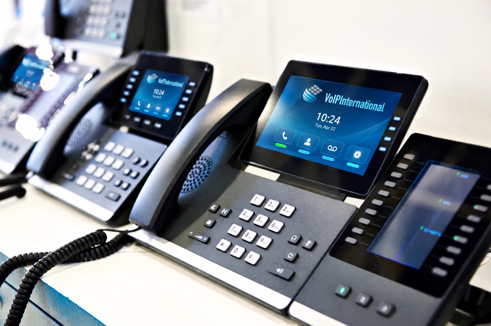 Business desk phones on a reception desk