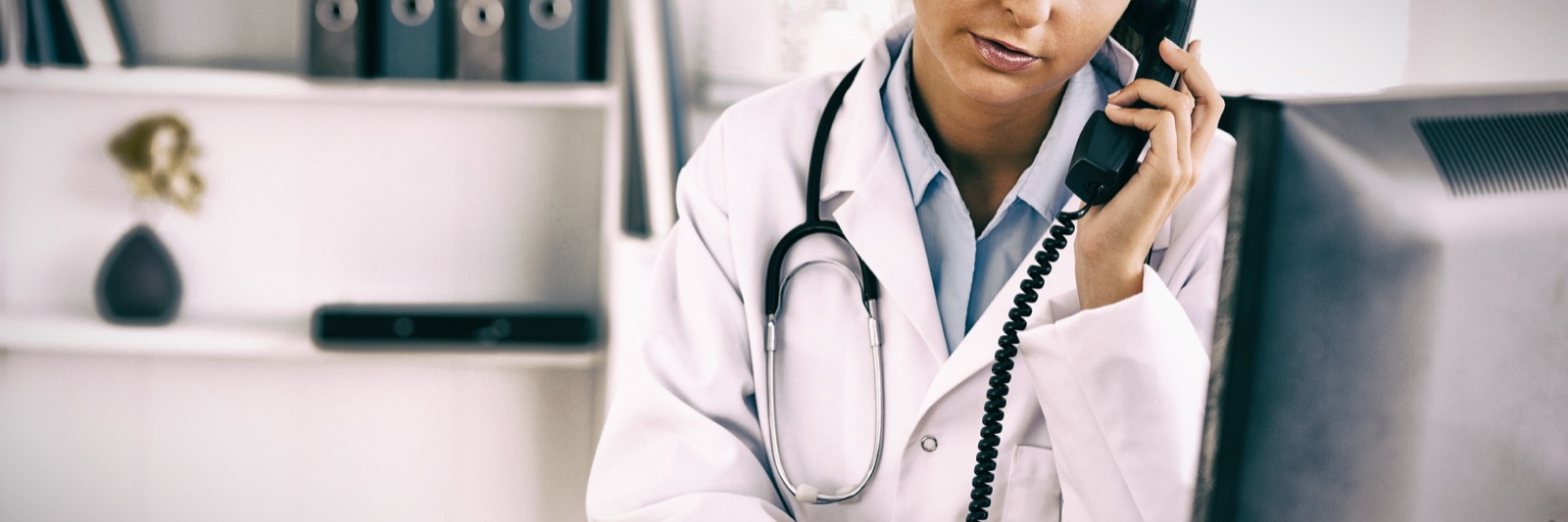 Doctor taking a call at the office