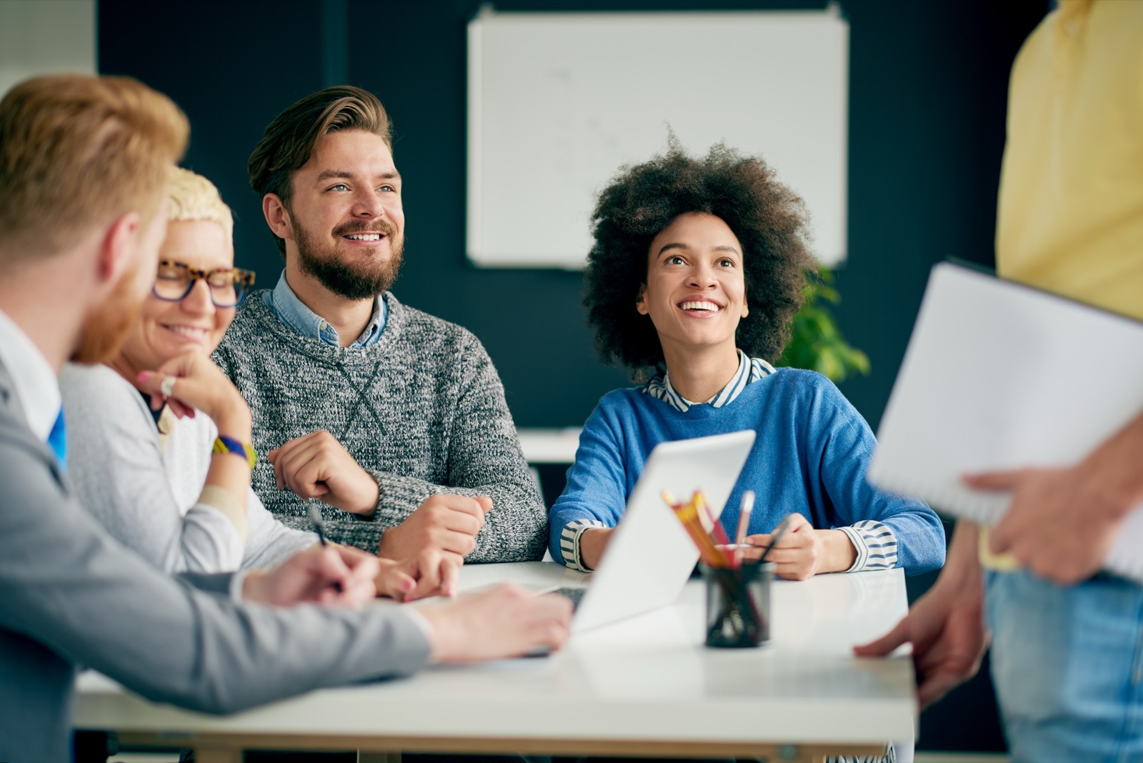 Coworkers smiling at a meeting