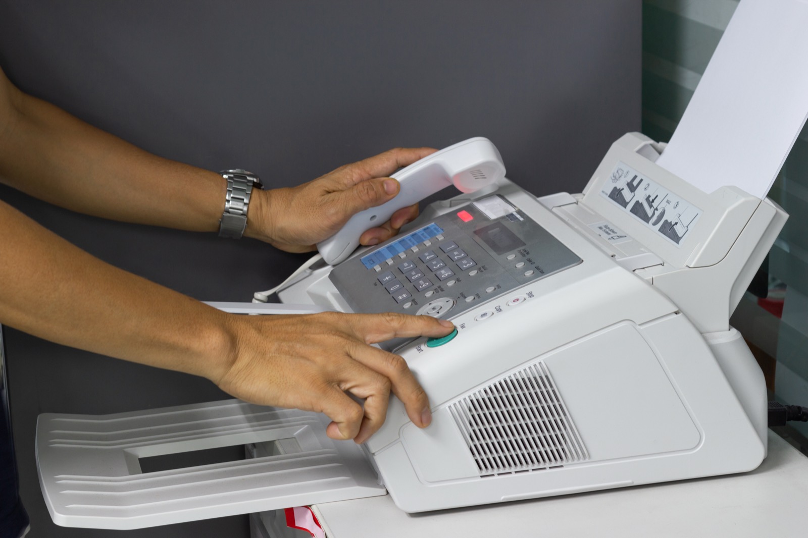 Document going through a fax machine