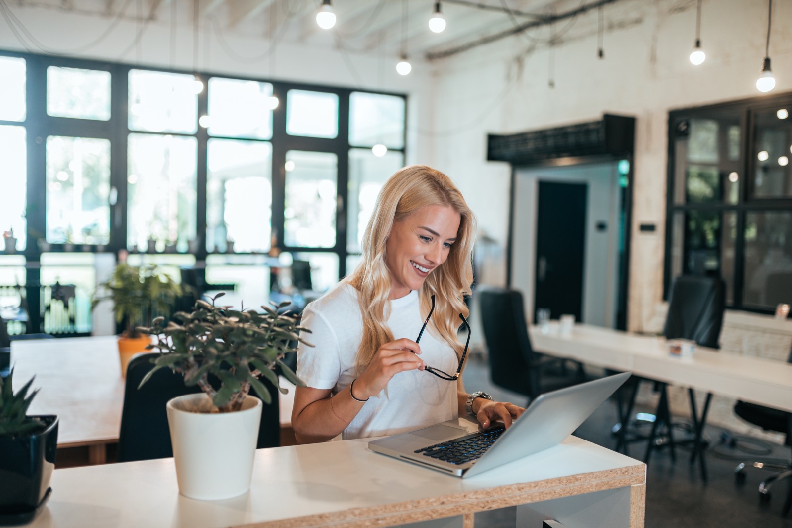 Owner managing jobs on her laptop
