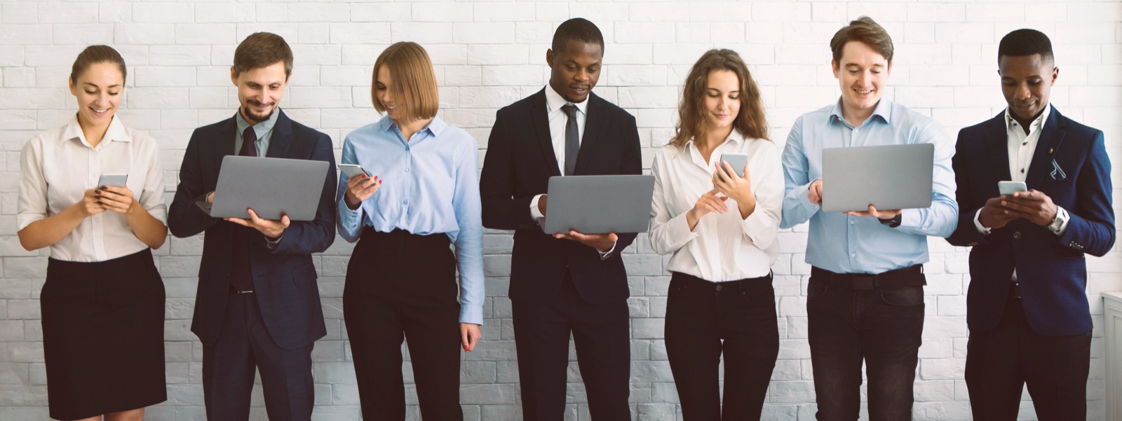 Staff with laptops and phones