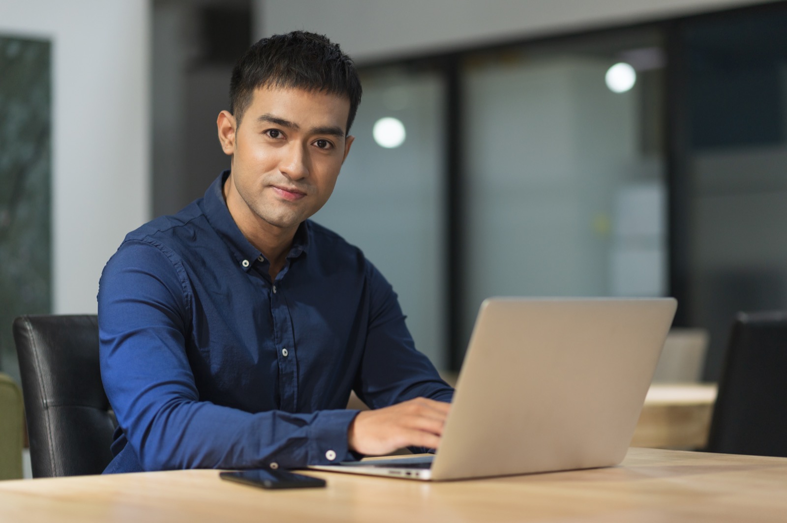 Professional working on his laptop