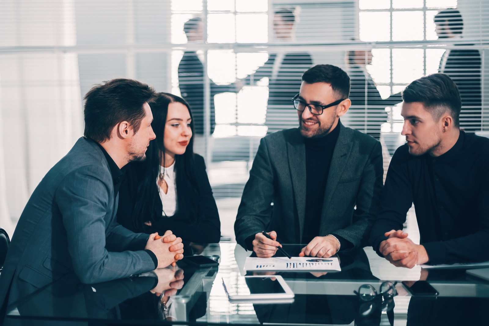 Business team comparing options at a meeting