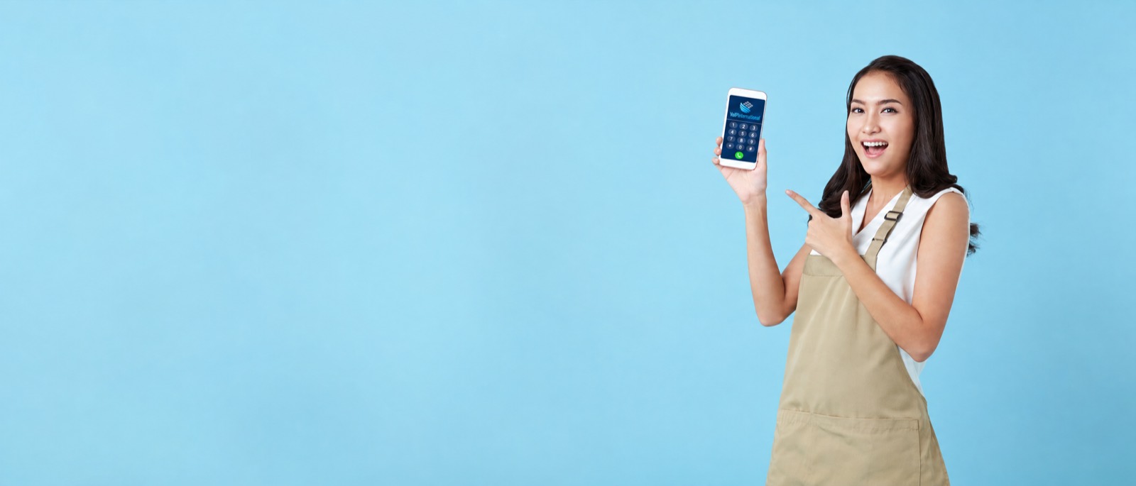 Shop owner holding her business phone