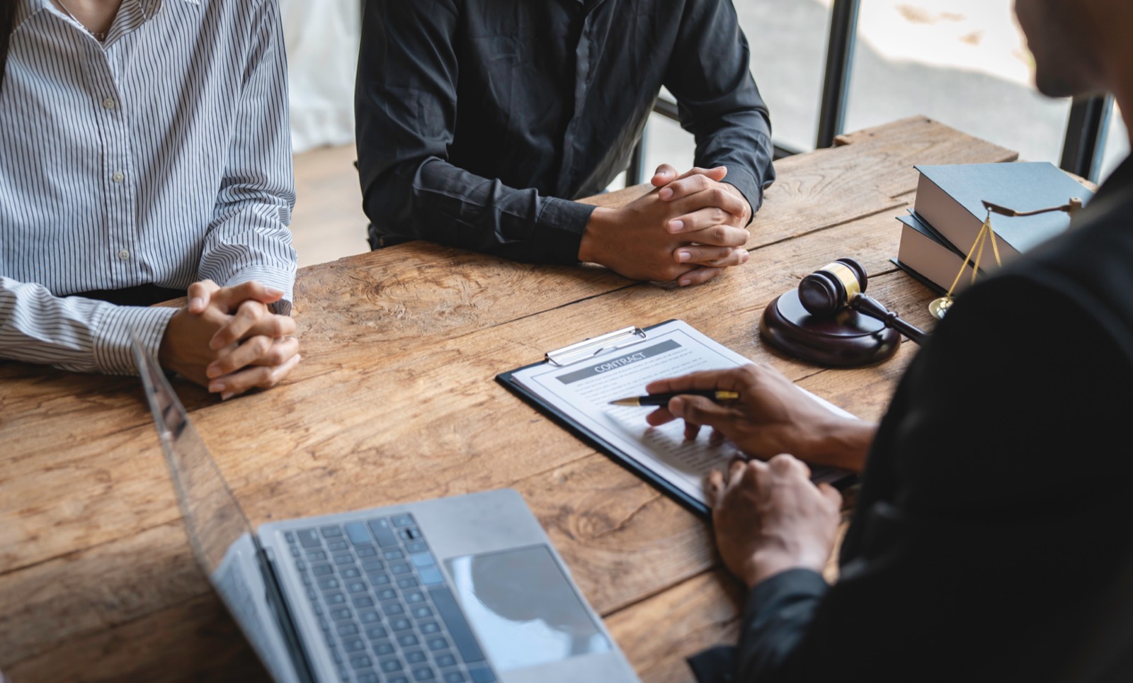 Lawyer and client reviewing papers